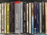 a lot of cassettes that are stacked on a shelf