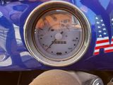 a close up of a speedometer on a motorcycle
