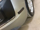 a close up of a car ' s bumper with a sticker on it