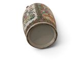 a vase that has a picture on it on a white surface