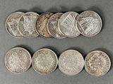 a close up of a bunch of coins sitting on top of a table