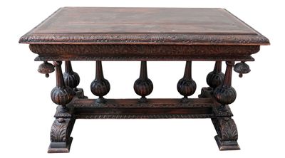 a wooden table with carvings on the top of it