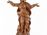 an image of a statue of a woman holding her hands out