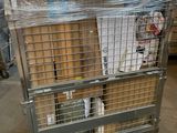a metal cart with a cage on top of it in a warehouse