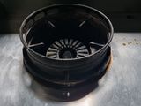 a metal bowl with a clock on top of it