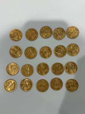 some gold coins are arranged in a circle on a white surface