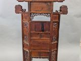 a wooden stand with a mirror on top of it