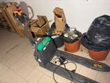 a pallet with a fork and a bag on it in a room