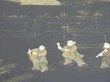 four figurines that are standing in the dark