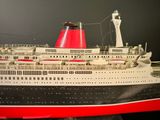 a model of a large cruise ship on a table