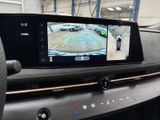 a picture of a car ' s rear view mirror with a camera attached to it