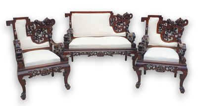 three chairs with white cushions and a white cushion on them