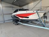 a boat that is being loaded into a trailer