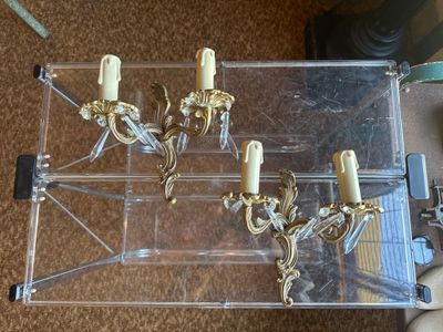 a clear box with three candles inside of it