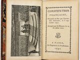 an open book with a picture of a man in a boat on it