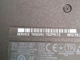 a label on the back of a laptop that says service tag