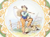 a plate with a picture of a boy holding a stick