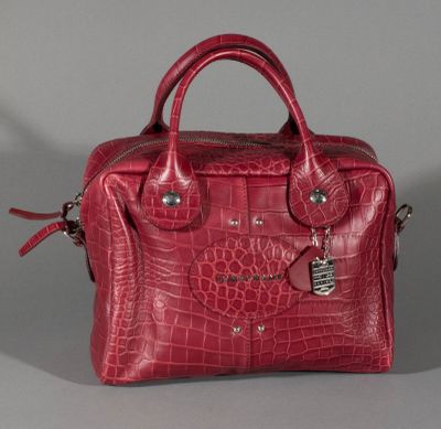 an image of a red purse sitting on top of a table