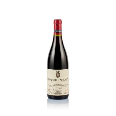 a bottle of wine sitting on top of a white surface