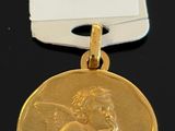 a close up of a gold medal with a tag on it