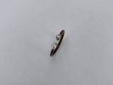 a close up of a small piece of metal on a white surface