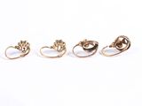 three gold rings with a flower and a leaf design on them