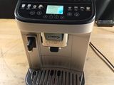 the coffee machine is sitting on the table ready to be used