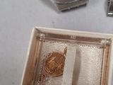 two watches sitting next to each other on a table