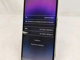 a phone that is sitting on a stand on a table
