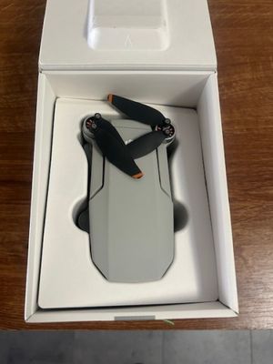 someone is opening up a box with a pair of scissors in it