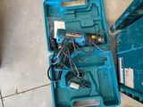 a blue tool box with tools in it on the floor