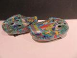 two ceramic fish figurines sitting on a table