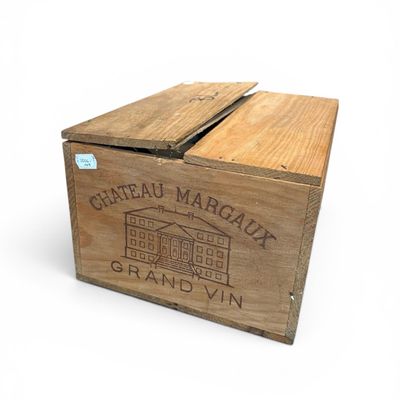a wooden box with a label on it that says chateau margaux grand vin