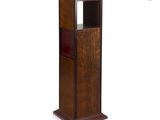 an image of a tall wooden bookcase with a glass door