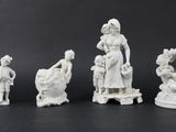 a group of white figurines sitting on top of a table