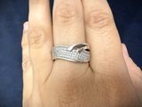 an image of a woman ' s hand with a wedding ring