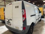 a white van that is parked in a garage