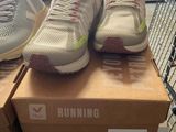 two pairs of running shoes on top of a box