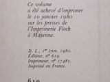 an open book with a black and white image of a clock