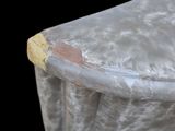 a close up of a table with a cloth covering it