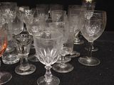 a lot of wine glasses sitting on a table
