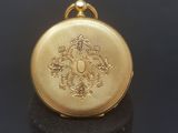 an image of a gold locke with a dragon on it