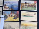 a lot of old postcards on display on a table