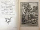an open book with a picture of a woman and a dog on it
