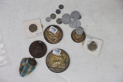 some coins and other items that are on a table