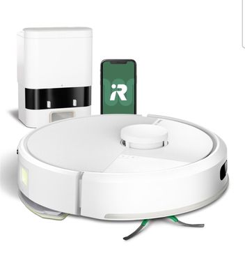 une image représentant un aspirateur robot sur lequel est posé un téléphone