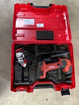 an image of a red tool box with tools inside of it