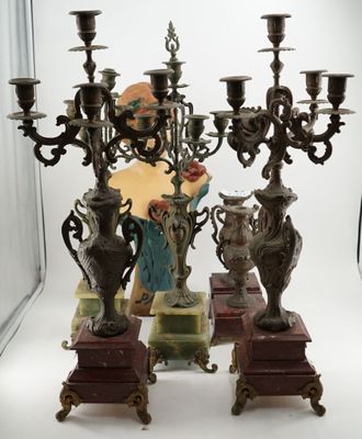 three candelabs that are sitting next to each other