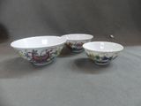 three bowls sitting next to each other on a table