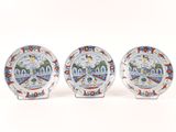 three plates with a picture of the white house on them